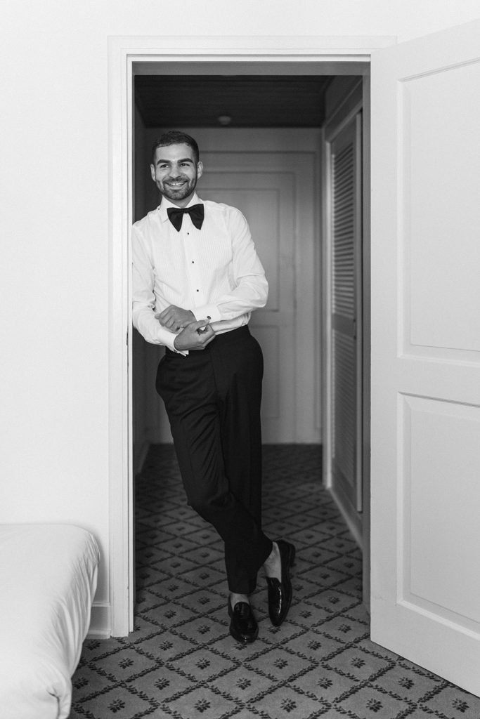 Groom getting ready before wedding at Queluz Palace Portugal