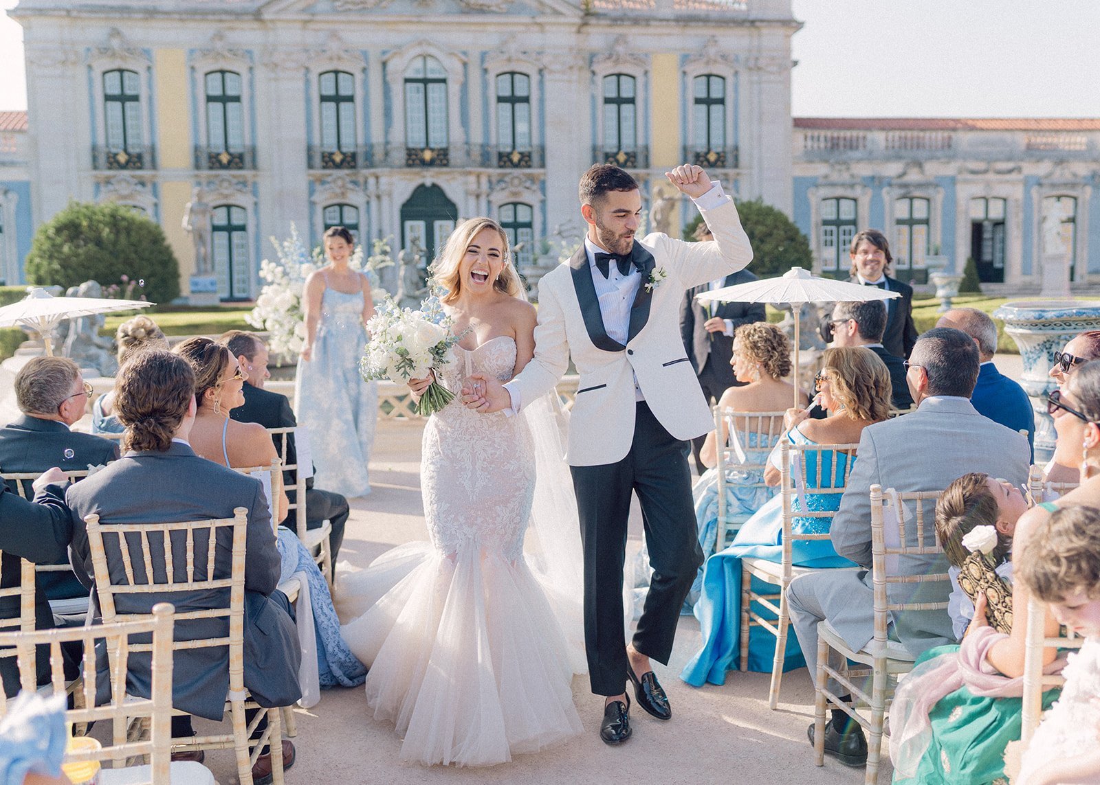 Bride and groom celebrating with guests at Queluz National Palace, Lisbon — wedding photographer Flavia Grandi, Portugal