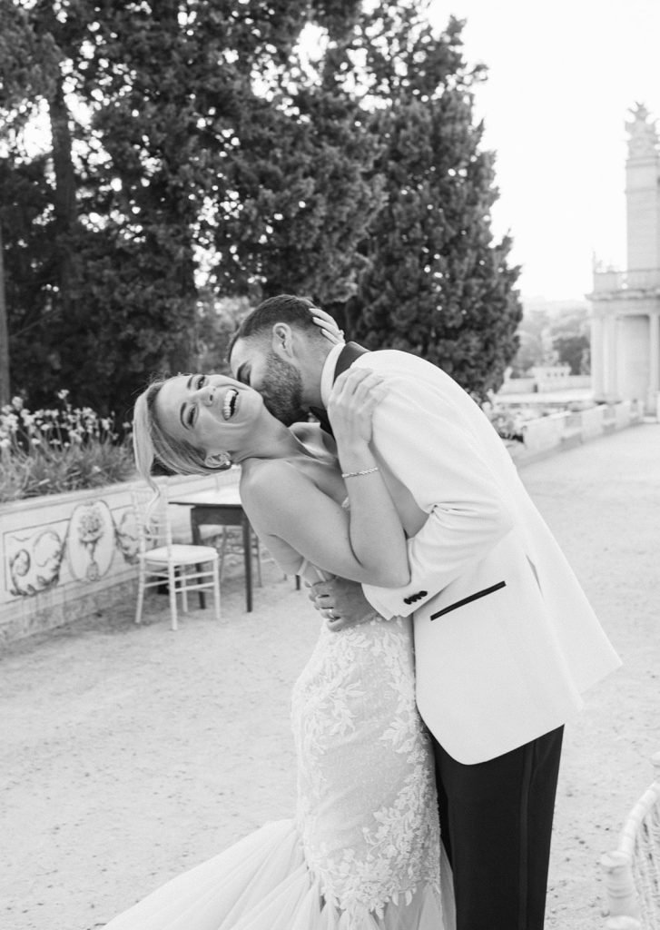 Candid moment between bride and groom at palace wedding