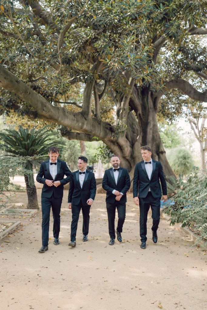 Groomsmen walking through Vandelli Botanical Garden in Lisbon