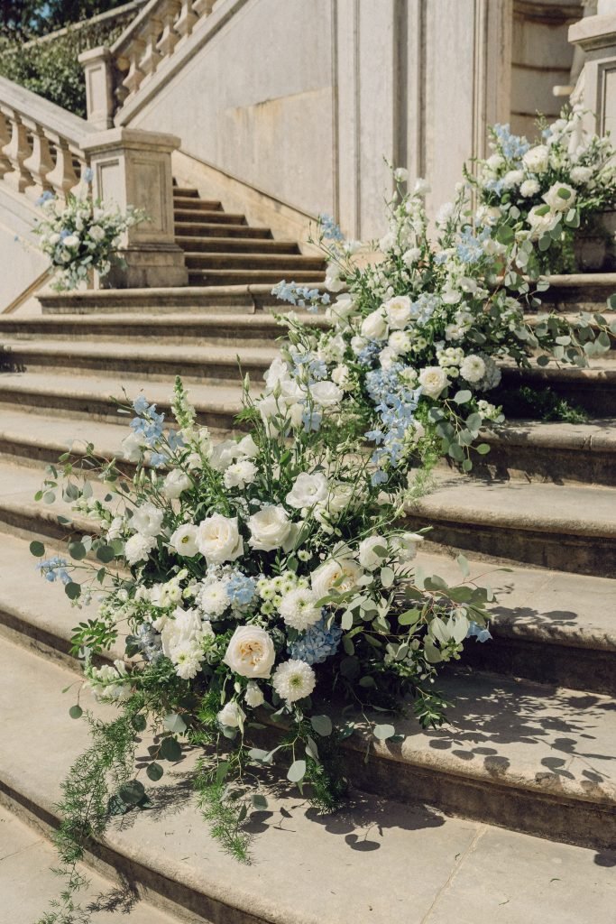 Blue and white wedding flowers on Vandelli Botanical Garden staircase