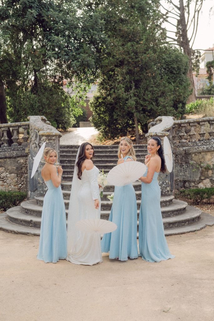 Bride and bridesmaids in blue dresses at Vandelli Botanical Garden