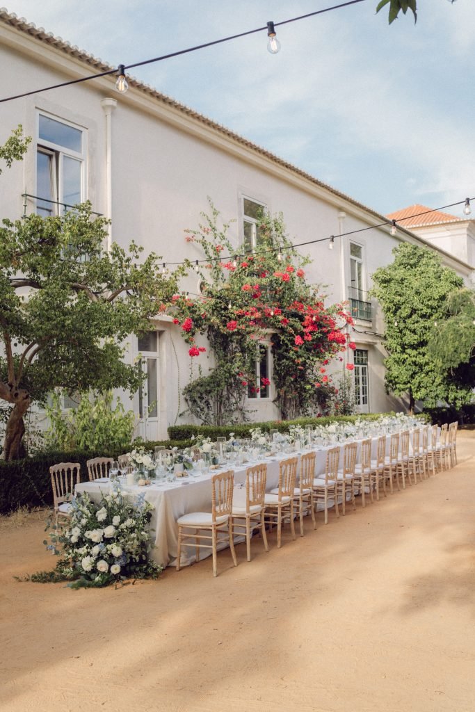 Outdoor wedding reception at Vandelli Botanical Garden Lisbon with long tables and garden setting