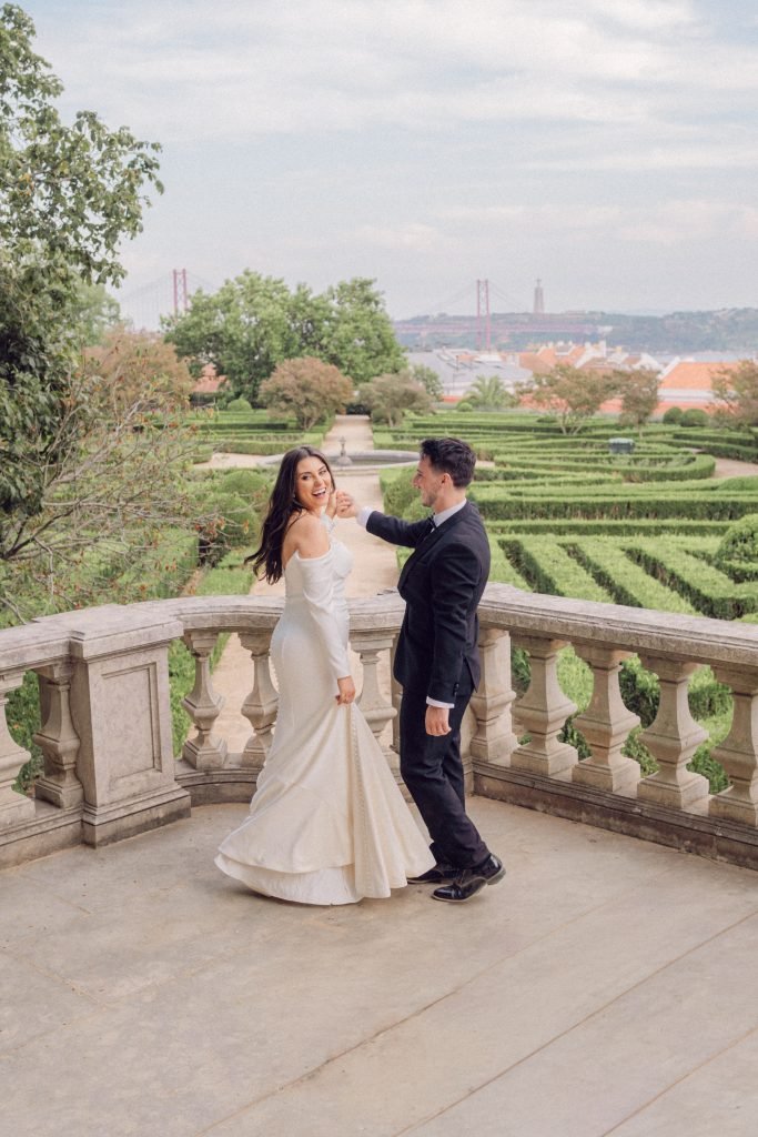 Bride and groom laughing together overlooking Lisbon gardens at Vandelli Botanical Garden wedding