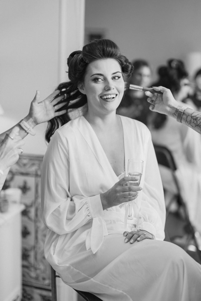 Bride having hair and makeup done before Lisbon wedding