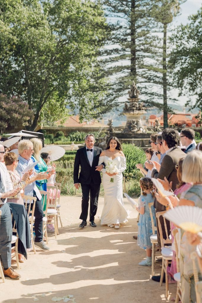 Bride walking down the aisle at Vandelli Botanical Garden wedding