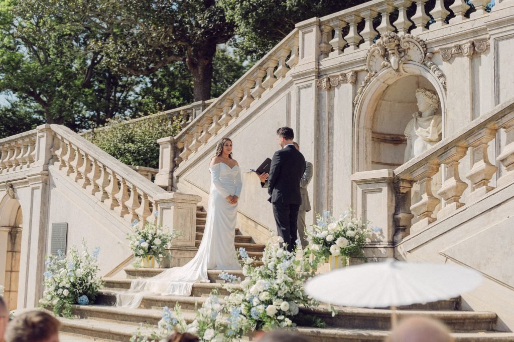 Bride and groom ceremony on historic staircase at Vandelli Botanical Garden