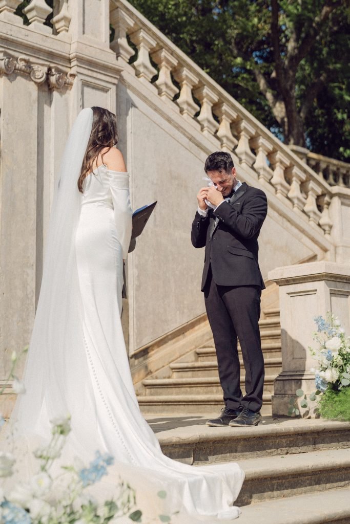 Groom wiping tears during emotional wedding ceremony in Lisbon